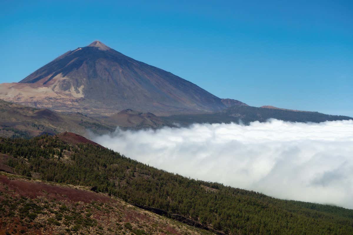 A collection of clouds trapped between mountains and plains overlooking the Teide volcano, one of Tenerife's must-see sights.