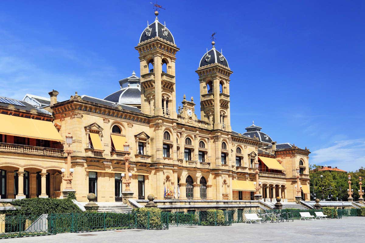 The façade of San Sebastian Town Hall under a clear blue sky