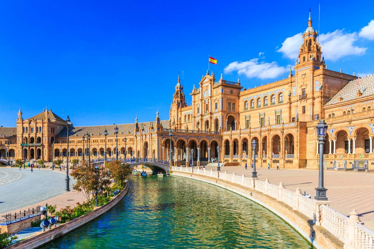 Plaza de España, Seville on a clear day, as seen from above the water.