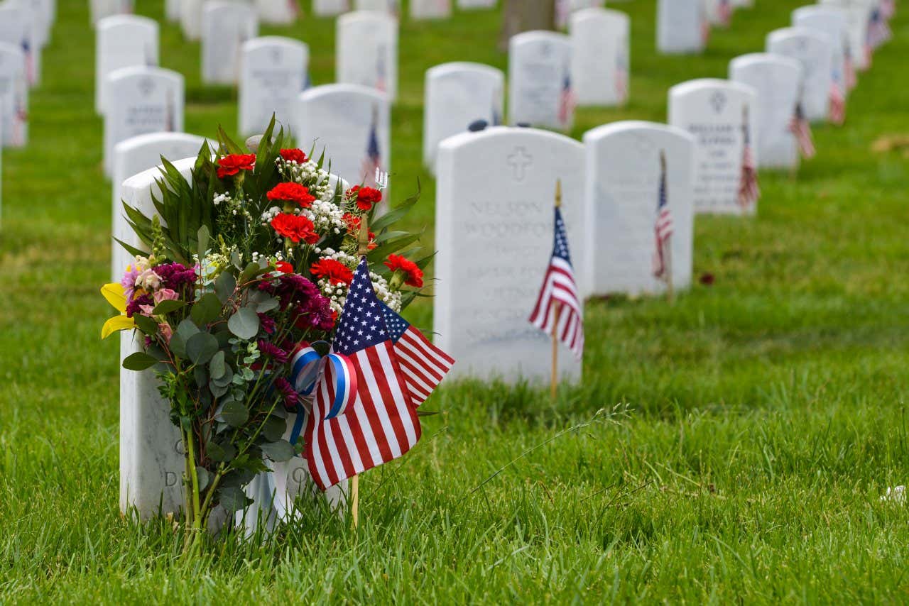 Arlington Cemetery with rows of tombstones with wreaths on a clear day with no people