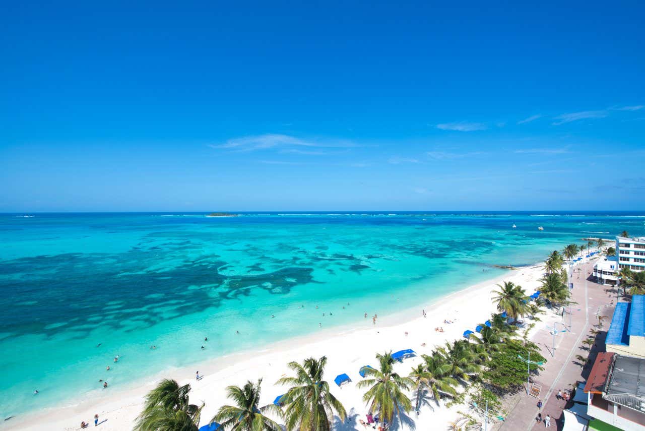 Beach with turquoise water and white sand on a sunny day