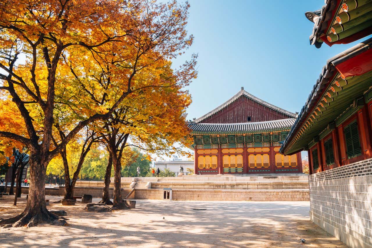 Deoksugung Palace in Seoul with a clear blue sky in the background at autumn.