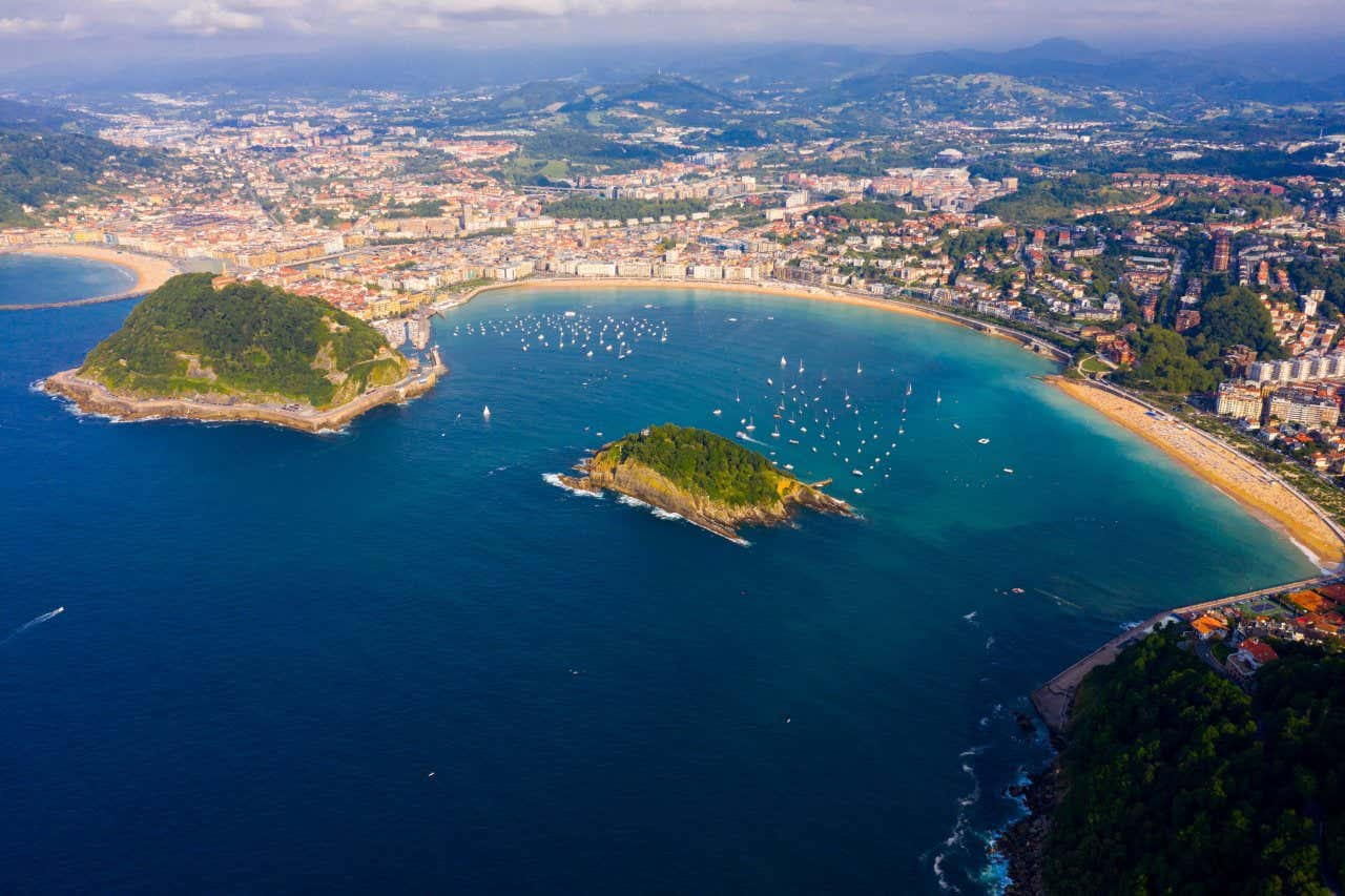 An aerial view of Santa Clara Island, with various boats visible sailing in the bay.