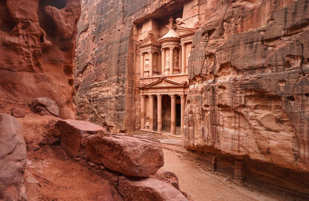 The treasury in Petra as seen from across the sand road.