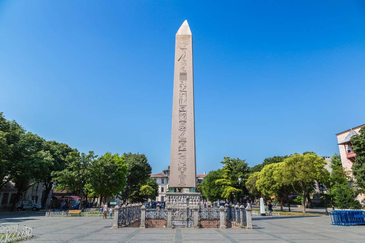 Obelisk of Theodosius in Sultanahmet Square with a clear blue sky in the background.