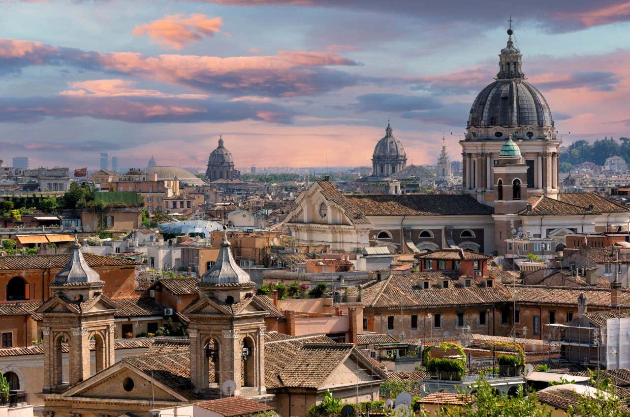 A panoramic view of Rome, with the domes of the various churches in sight.