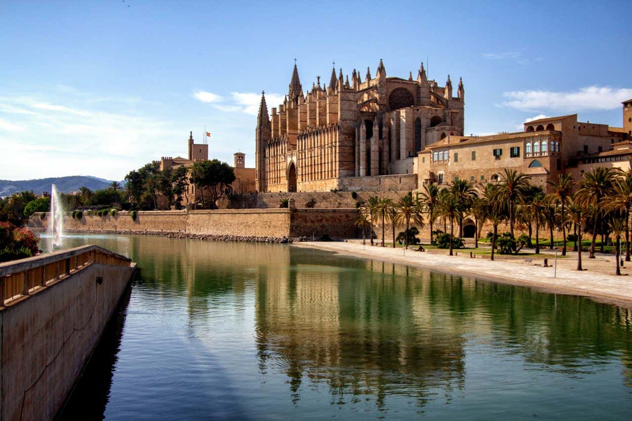 Views of the main cathedral in Palma, surrounded by a river