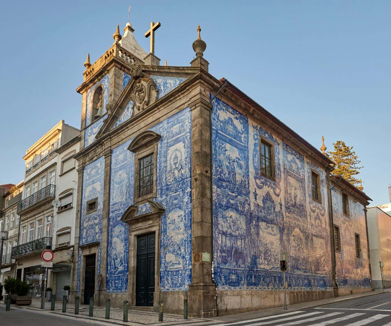 A building adorned with intricate blue and white ceramic tiles and a bell tower