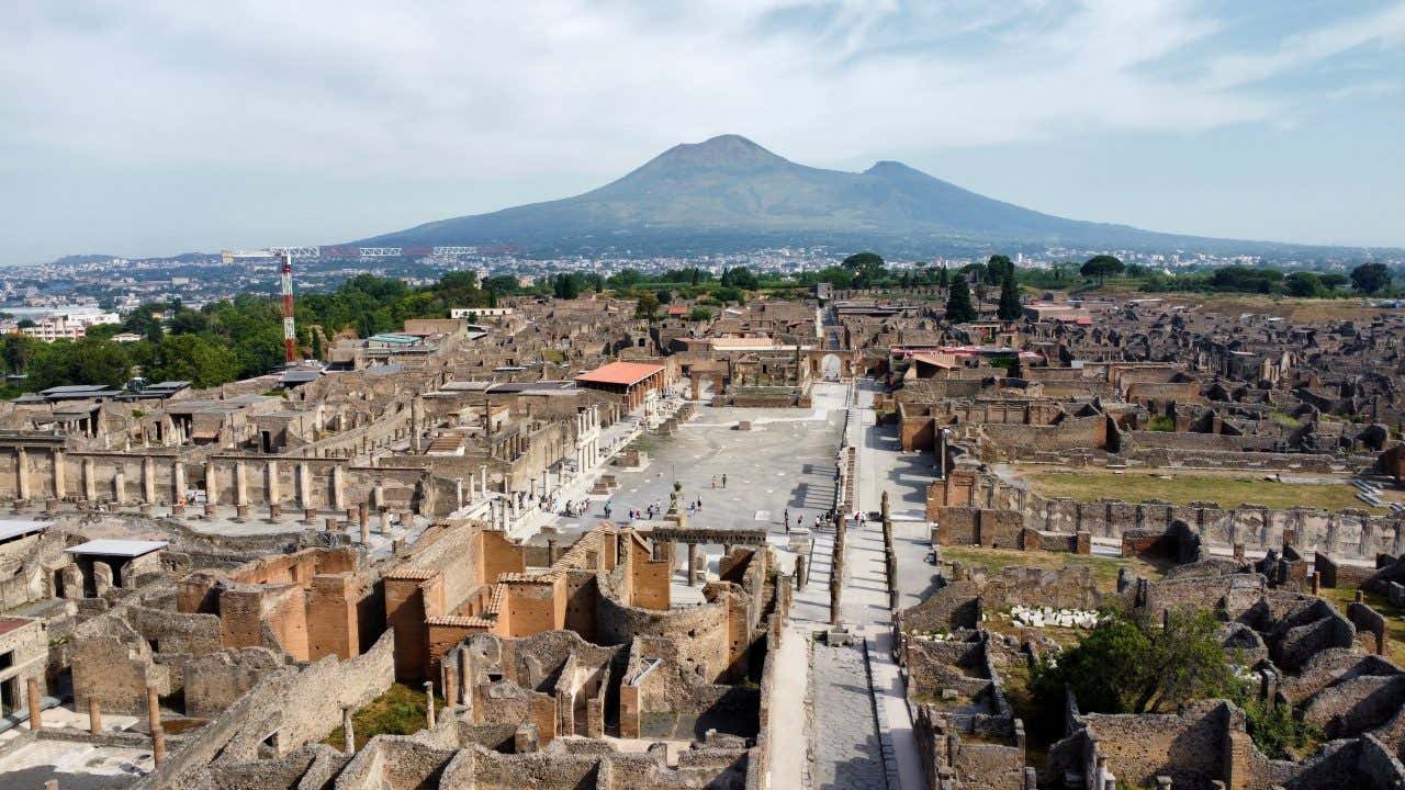 An aerial shot of the Forum in Pompeii, with many other structures also in view.