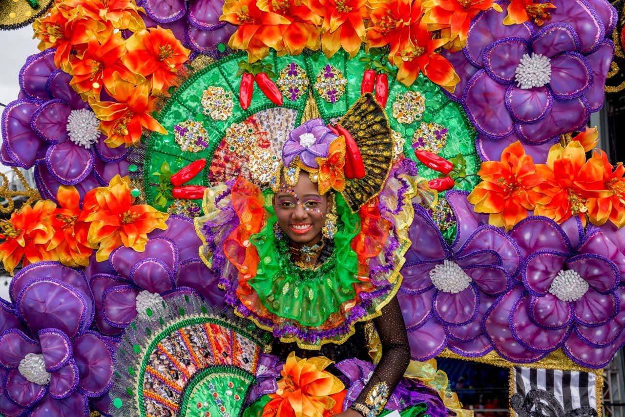 A woman wearing a highly decorative Carnival costume.