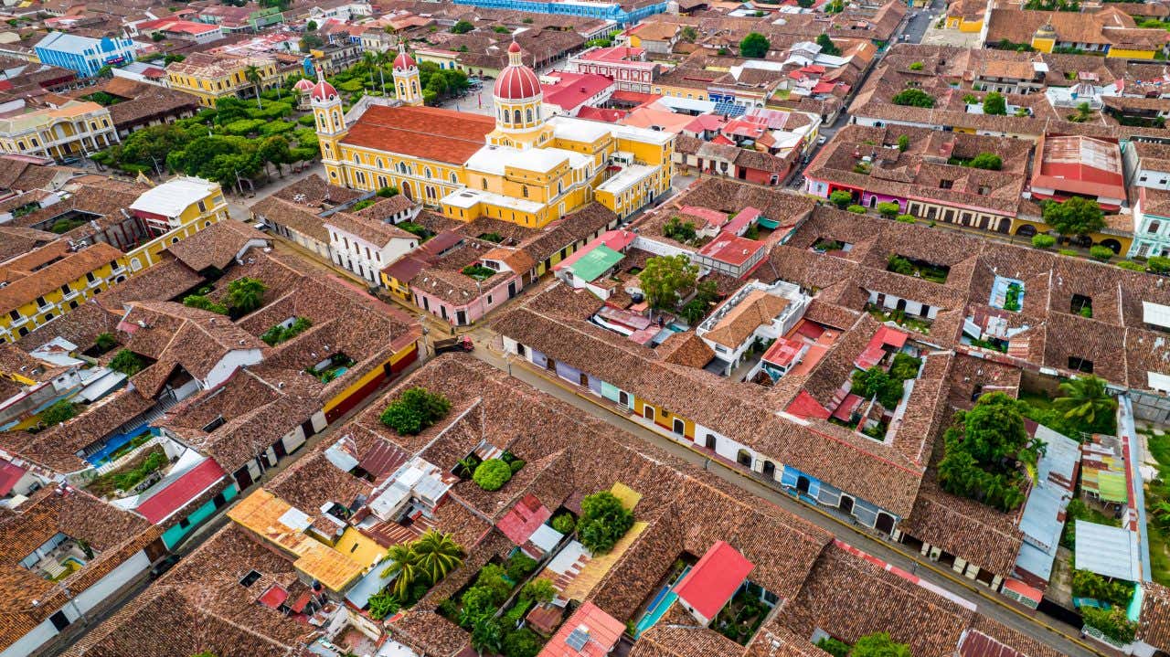 An aerial shot of Granada, Nicaragua, with lots of colorful buildings in view.