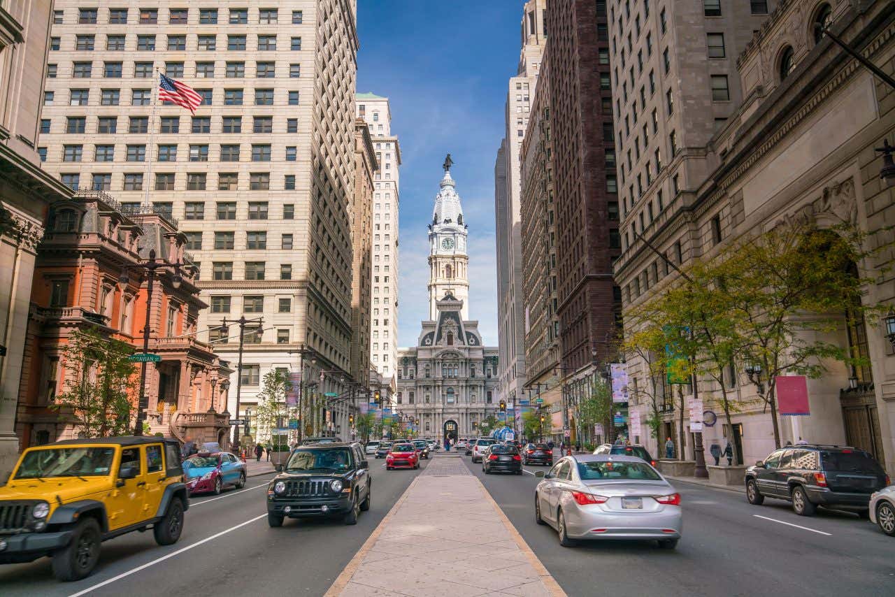 A street in Philadelphia, PA with cars on each side of the street.