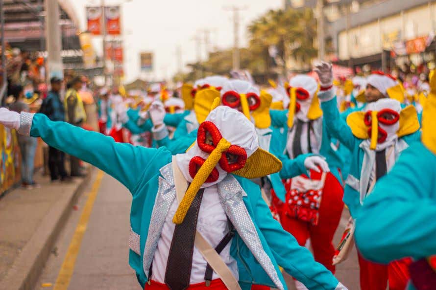 People dressed up in costumes celebrating Carnival in Barranquilla, Colombia.