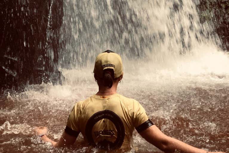 Enjoying a dip in the Loto Waterfall 