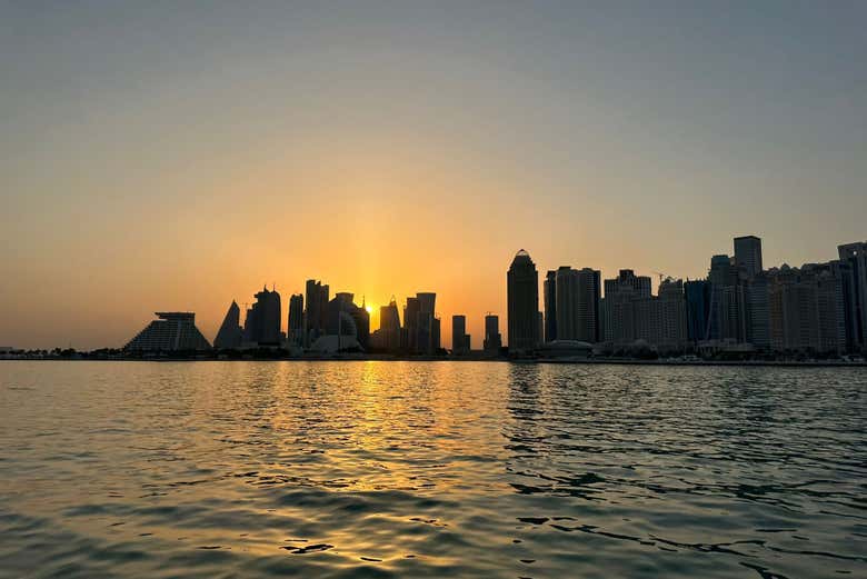 The sun sets over Doha