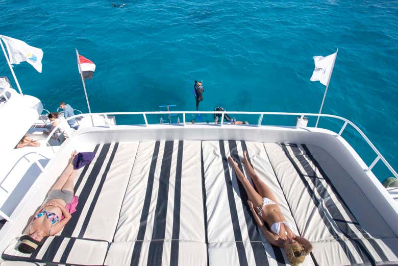 Sunbathe on the boat's sun decks