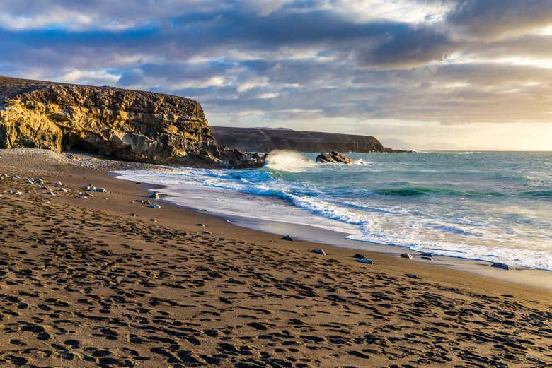 Watch the sunset over the Cuevas de Ajuy