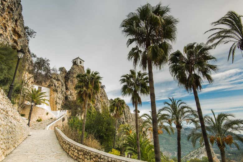 Visit Guadalest, a town nestled in the mountains 