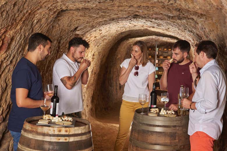 Enjoying a cheese tasting inside a cave