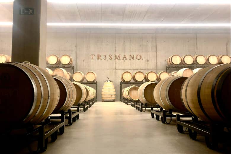 Admire the barrels full of aging wine