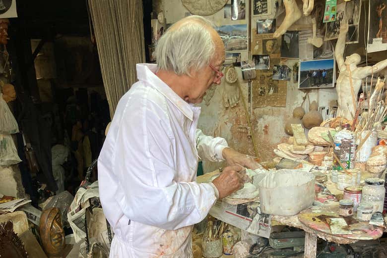 Visit the art studio of a renowned sculptor