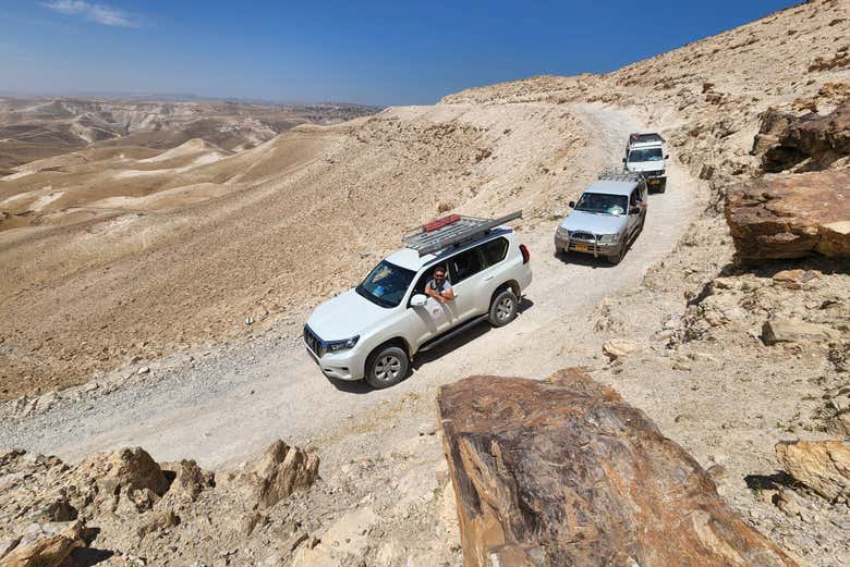 Take an offroading vehicle through the desert