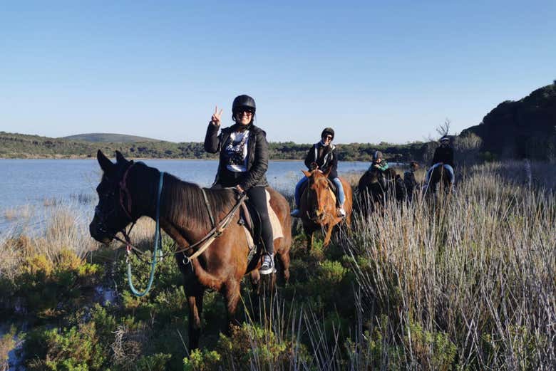 Ride horses along the shore of Lake Baratz