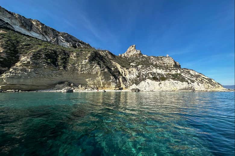 Glide along the crystal-clear waters of Sardinia