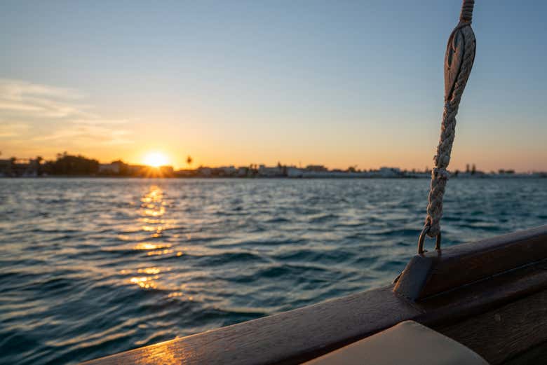 Admire the sunset on board a boat