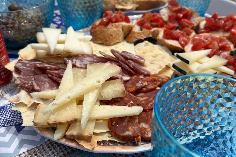 Taste local cheeses and meats