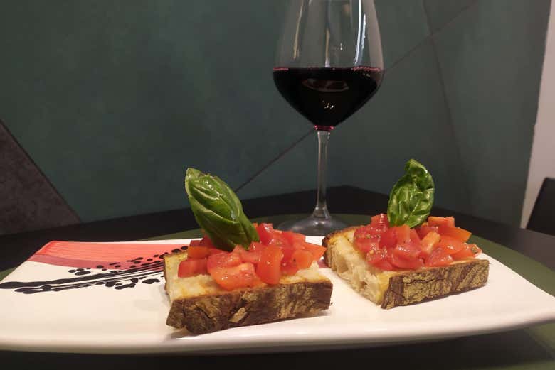 Enjoy a delicious bruschetta and a glass of wine