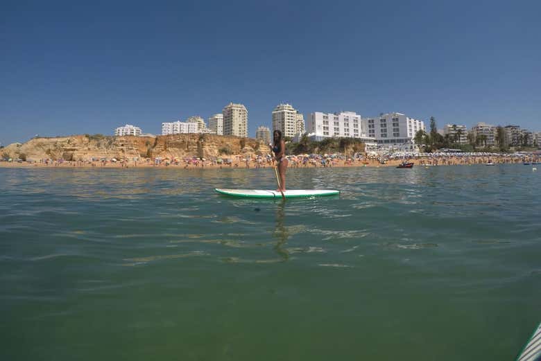 Having fun paddle surfing in Armação de Pêra