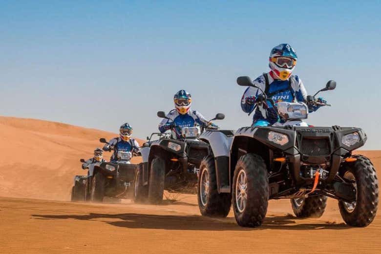 Driving a quad bike in the Sahara desert